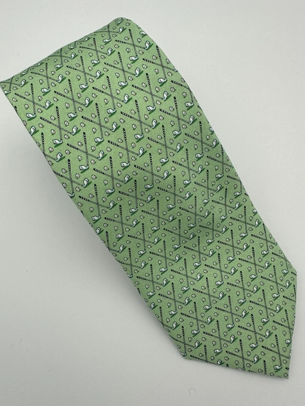 Vineyard Vines men's green silk necktie featuring a repeating golf club and ball